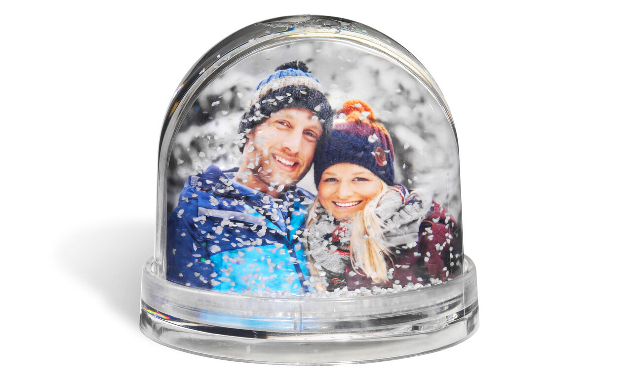 Snöglob med personlig bild, vacker vinteratmosfär